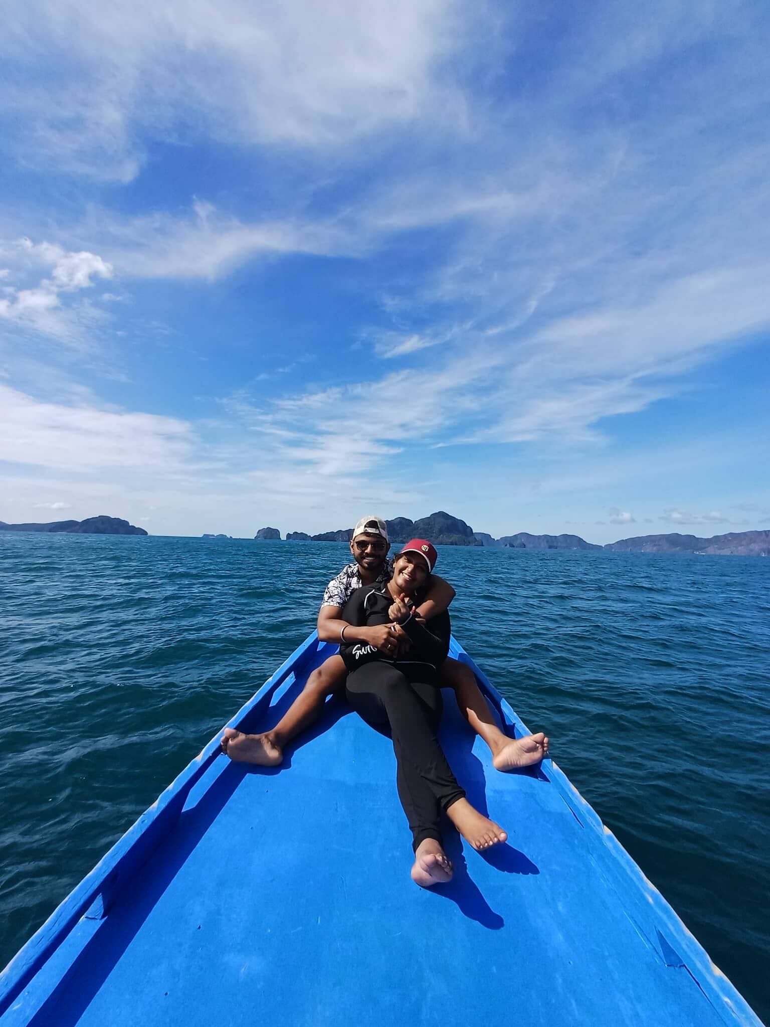 Couple enjoying a private boat ride during a Palawan island tour