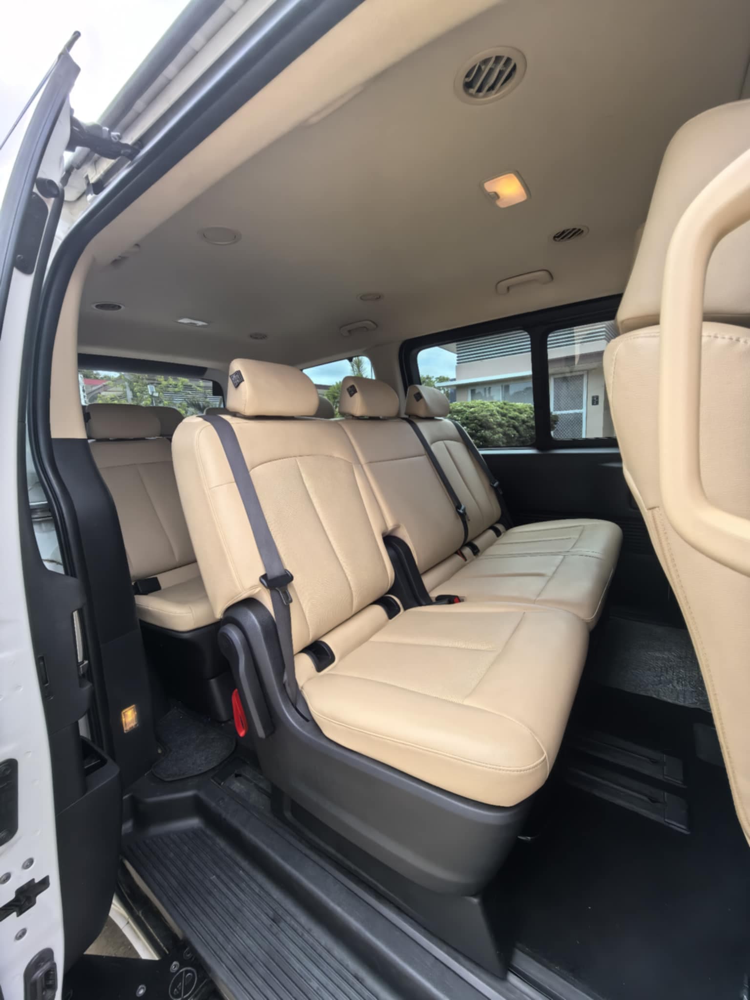 Van rental Palawan - easy side door access to premium interior